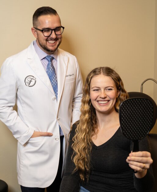 Reading Plastic Surgeon Dr. Matthew Hagan looking at results with patient