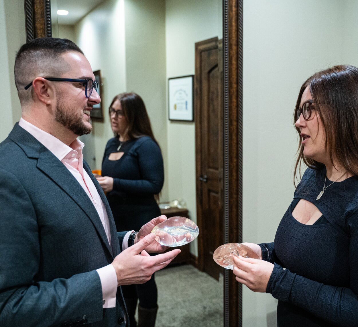 Reading Plastic Surgeon Dr. Matthew Hagan Speaking with patient about implants